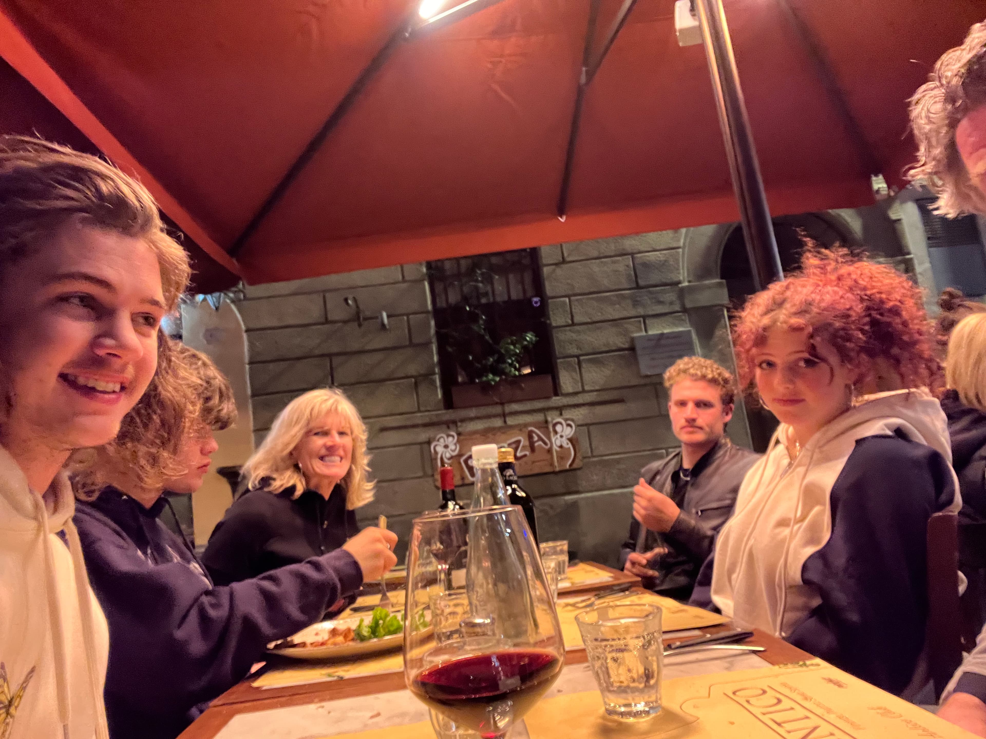 Family gathered around a restaurant table