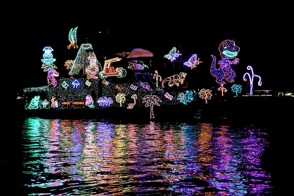 A boat decorated with colorful holiday lights at the Newport Beach boat parade
